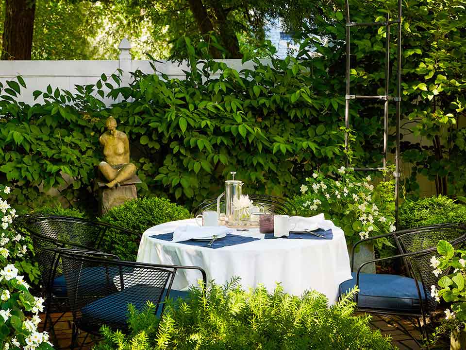 Wickwood Inn out on the terrace under the arbor