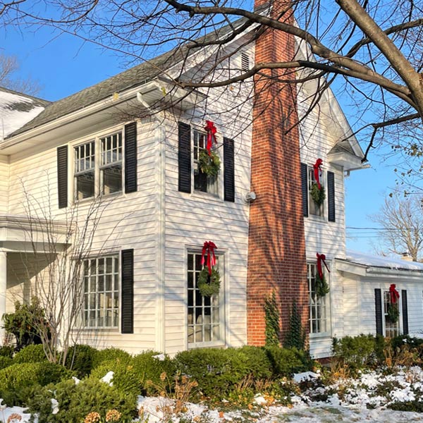 Wickwood Inn celebrating the seasons with wreaths on the windows - Wickwood Inn