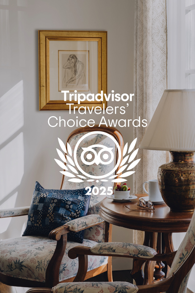 Boutique inn lounge with vintage décor awarded 2025 Travelers Choice Award by TripAdvisor